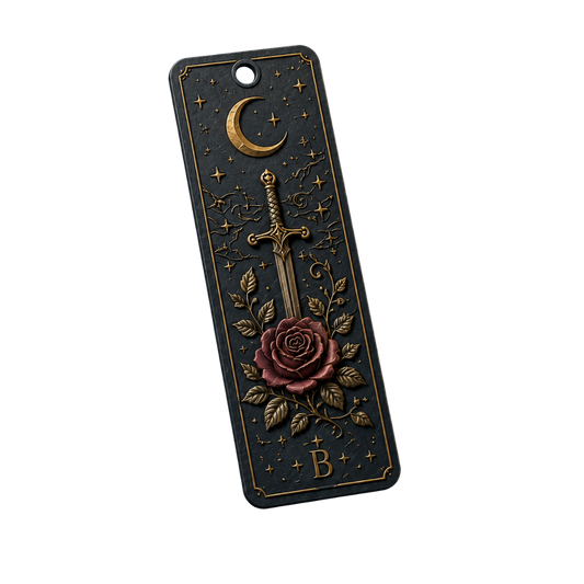 Decorative bookmark with sword, rose, and moon design on a black background